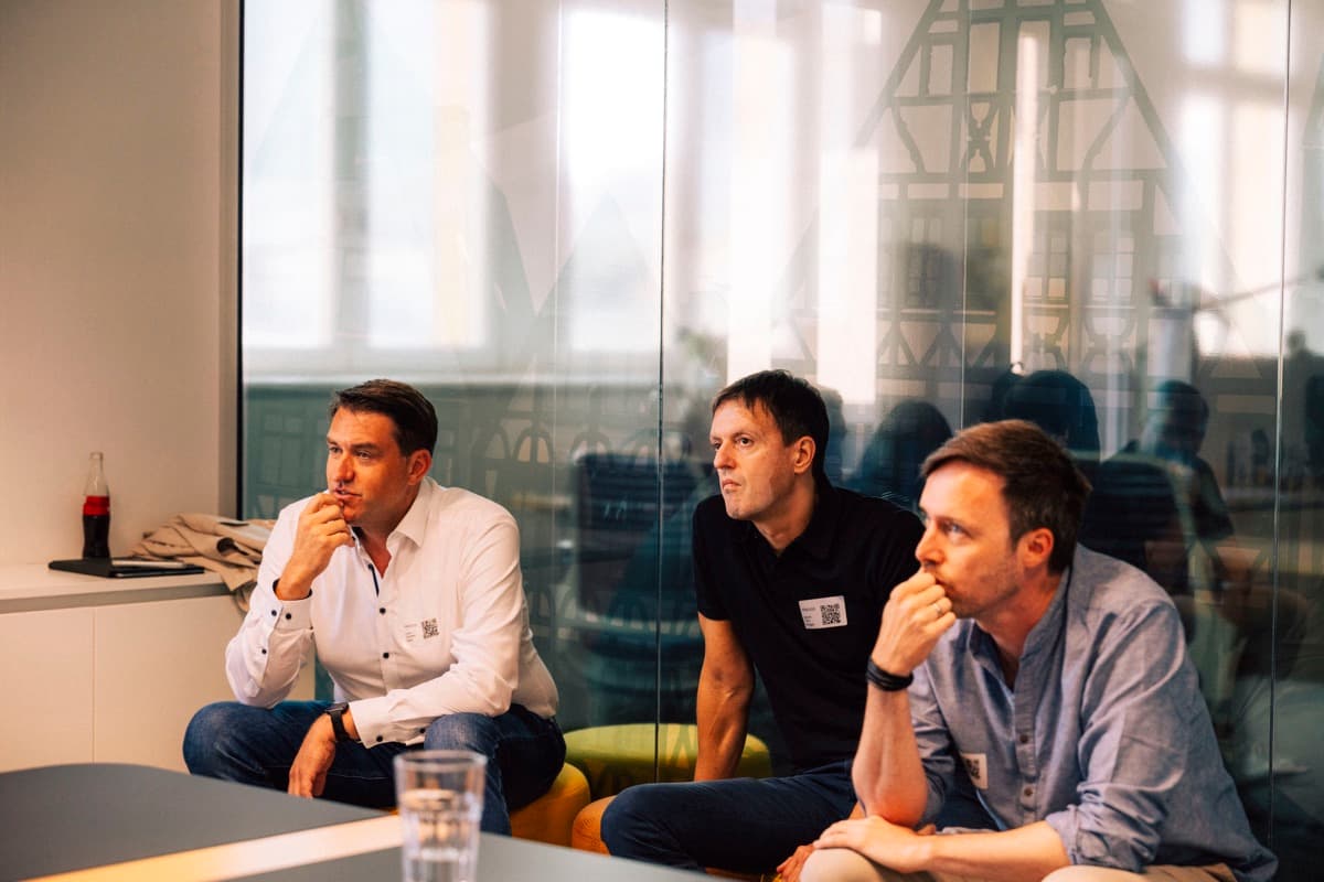 Community members listening to a session
